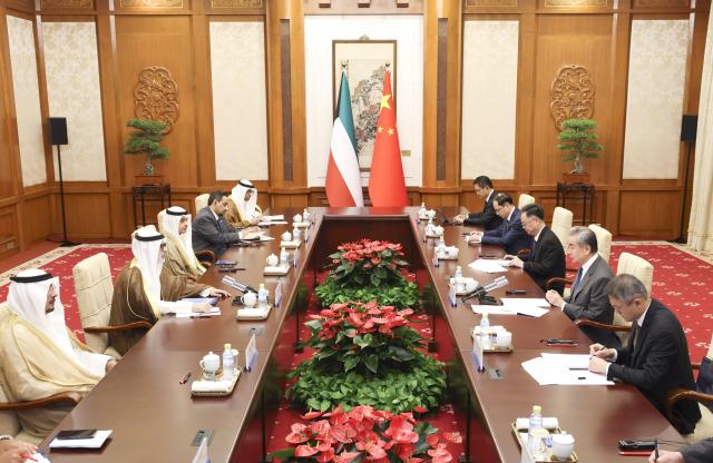 (260824) -- BEIJING, Aug. 24, 2026 (Xinhua) -- Chinese Foreign Minister Wang Yi, also a member of the Political Bureau of the Communist Party of China Central Committee, holds talks with Sheikh Jarrah Jaber Al-Ahmad Al-Sabah, Minister of Foreign Affairs of Kuwait, in Beijing, capital of China, Aug. 24. 2026. (Xinhua/Pang Xinglei)