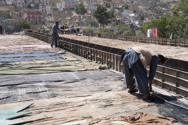 (260824) -- KABUL, Aug. 24, 2026 (Xinhua) -- Workers build an overpass project in Kabul, Afghanistan, on Aug. 24, 2026. TO GO WITH "Afghanistan approves nearly 100 mln USD in strategic infrastructure projects" (Photo by Saifurahman Safi/Xinhua)