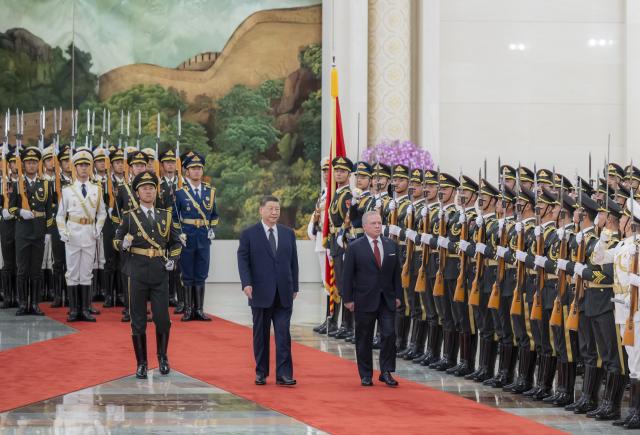 (260824) -- BEIJING, Aug. 24, 2026 (Xinhua) -- Chinese President Xi Jinping holds a welcome ceremony for King of the Hashemite Kingdom of Jordan Abdullah II ibn Al Hussein in the Northern Hall of the Great Hall of the People prior to their talks in Beijing, capital of China, Aug. 24, 2026. Xi held talks with King Abdullah II, who is on a state visit to China, in Beijing on Monday. (Xinhua/Zhai Jianlan)