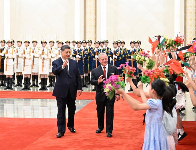 (260824) -- BEIJING, Aug. 24, 2026 (Xinhua) -- Chinese President Xi Jinping holds a welcome ceremony for King of the Hashemite Kingdom of Jordan Abdullah II ibn Al Hussein in the Northern Hall of the Great Hall of the People prior to their talks in Beijing, capital of China, Aug. 24, 2026. Xi held talks with King Abdullah II, who is on a state visit to China, in Beijing on Monday. (Xinhua/Shen Hong)