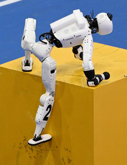 (260824) -- BEIJING, Aug. 24, 2026 (Xinhua) -- The robot of Tianxiao Team competes during 100m Obstacles of the 2nd World Humanoid Robot Games in Beijing, capital of China, Aug. 24, 2026. (Xinhua/Zhang Chenlin)