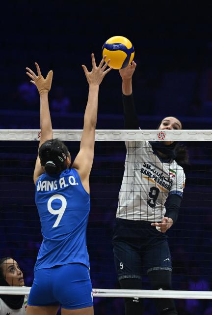 (260824) -- TIANJIN, Aug. 24, 2026 (Xinhua) -- Reyhane Karimi (R) of Iran spikes the ball during the pool A match between China and Iran at AVC Women's Volleyball Continental Championship in Tianjin, China, Aug. 24, 2026. (Xinhua/Zhao Zishuo)