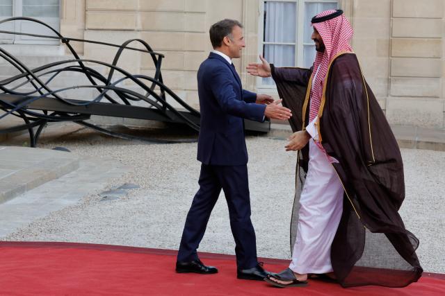 (260824) -- PARIS, Aug. 24, 2026 (Xinhua) -- French President Emmanuel Macron (L) welcomes Saudi Crown Prince and Prime Minister Mohammed bin Salman bin Abdulaziz Al Saud at Elysee Palace, in Paris, France, Aug. 24, 2026. (Photo by Henri Szwarc/Xinhua)