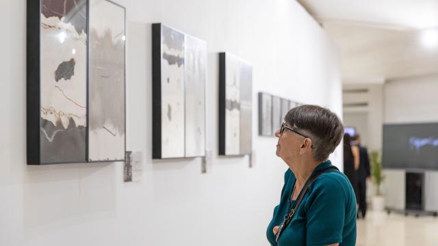(260824) -- BELGRADE, Aug. 24, 2026 (Xinhua) -- A visitor views an exhibition themed "Ink Art Asks the Future: International Touring Exhibition of Chinese Ink Art in the Era of AI" in Belgrade, Serbia, Aug. 24, 2026. An international touring exhibition exploring the intersection of traditional Chinese ink art and artificial intelligence (AI) opened Monday at the Chinese Cultural Center in Belgrade. (Photo by Wang Wei/Xinhua)
