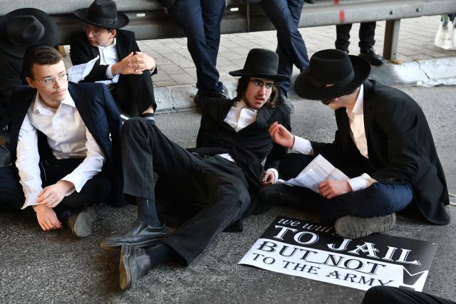(260824) -- BNEI BRAK, Aug. 24, 2026 (Xinhua) -- Ultra-Orthodox Jews stage a protest against the expansion of military conscription near Bnei Brak, Israel, Aug. 24, 2026. (JINI via Xinhua)