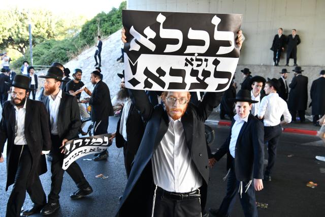 (260824) -- BNEI BRAK, Aug. 24, 2026 (Xinhua) -- Ultra-Orthodox Jews stage a protest against the expansion of military conscription near Bnei Brak, Israel, Aug. 24, 2026. (JINI via Xinhua)