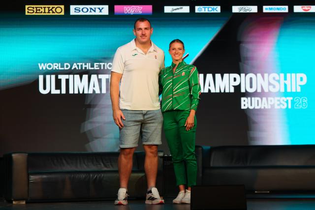 (260825) -- BUDAPEST, Aug. 25, 2026 (Xinhua) -- Hungarian sprint runner Boglarka Takacs (R) and hammer thrower Bence Halasz pose for a photo during a press conference of the World Athletics Ultimate Championship in Budapest, Hungary on Aug. 24, 2026. To go with "Hungary looks to Ultimate Championship to build on athletics growth" (Photo by Attila Volgyi/Xinhua)