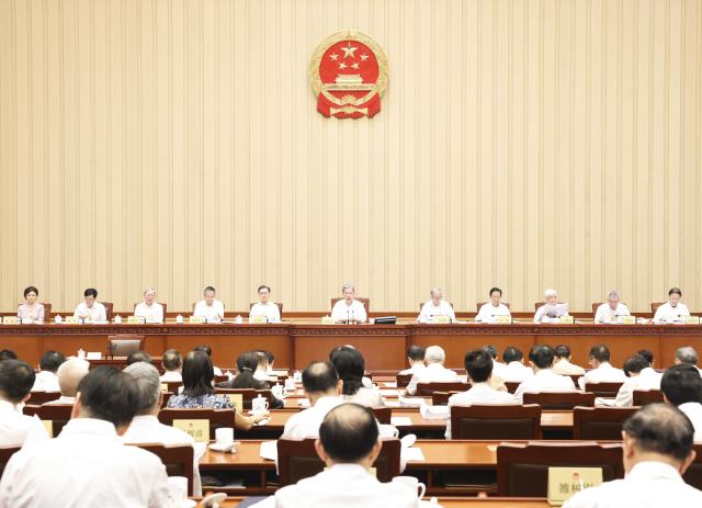 (260825) -- BEIJING, Aug. 25, 2026 (Xinhua) -- Zhao Leji, chairman of the National People's Congress (NPC) Standing Committee, presides over the first plenary meeting of the 24th session of the 14th NPC Standing Committee at the Great Hall of the People in Beijing, capital of China, Aug. 25, 2026. (Xinhua/Pang Xinglei)