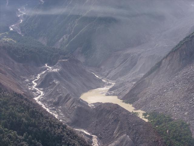 (260827) -- LHASA, Aug. 27, 2026 (Xinhua) -- An aerial drone photo taken on Aug. 27, 2026 shows a barrier lake formed after a mudslide in Nepal.
  The mudslide caused significant casualties along the China-Nepal border (Xinhua/Li Jian)