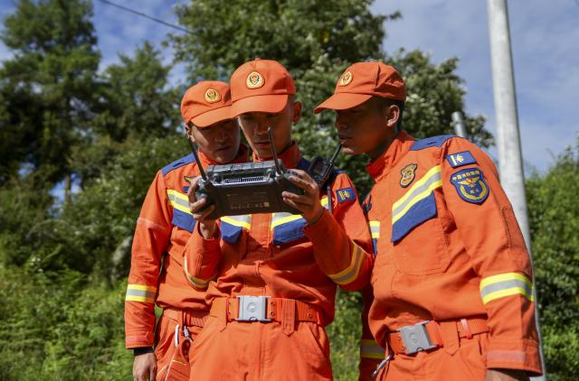 (260827) -- XIGAZE, Aug. 27, 2026 (Xinhua) -- Rescuers inspect the mudslide-hit areas with a drone, in Xigaze, southwest China's Xizang Autonomous Region, Aug. 27, 2026.
  A mudslide, which occurred on the Nepalese side, struck Gyirong Port in Gyirong County of Xigaze City, Xizang, on Wednesday morning, leaving three people dead and 558 others, including 260 foreign nationals, missing, according to preliminary estimates. (Xinhua/Jigme Dorje)