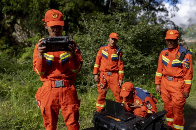 (260827) -- XIGAZE, Aug. 27, 2026 (Xinhua) -- Rescuers inspect the mudslide-hit areas with a drone, in Xigaze, southwest China's Xizang Autonomous Region, Aug. 27, 2026.
  A mudslide, which occurred on the Nepalese side, struck Gyirong Port in Gyirong County of Xigaze City, Xizang, on Wednesday morning, leaving three people dead and 558 others, including 260 foreign nationals, missing, according to preliminary estimates. (Xinhua/Jigme Dorje)