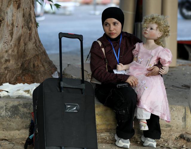 (260827) -- BEIRUT, Aug. 27, 2026 (Xinhua) -- This photo taken on Aug. 27, 2026 in Beirut, Lebanon, shows a displaced Syrian woman preparing to return to Syria through the Masnaa border crossing. (Xinhua/Bilal Jawich)