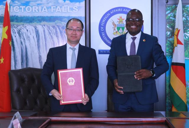 (260827) -- HARARE, Aug. 27, 2026 (Xinhua) -- Zimbabwean Minister of Foreign Affairs and International Trade Amon Murwira (R) and Chinese Assistant Minister of Commerce Zhang Li pose for a group photo in Harare, Zimbabwe, on Aug. 26, 2026. China and Zimbabwe have reaffirmed their commitment to deepening bilateral economic and trade ties at the 11th Session of the Joint Commission on Economic, Technical and Trade Cooperation in the Zimbabwean capital of Harare. (Photo by Tafara Mugwara/Xinhua)