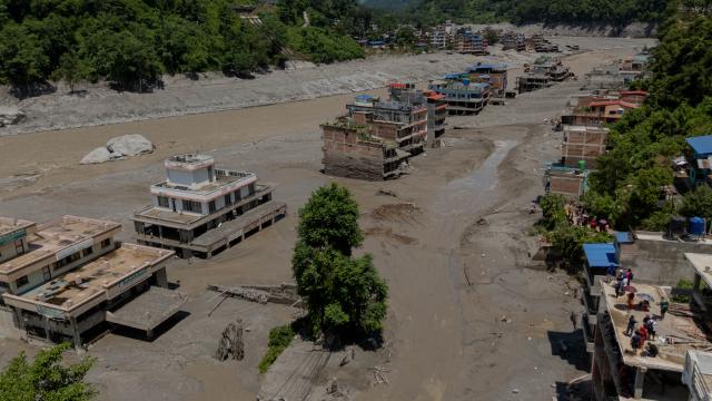 (260827) -- NUWAKOT, Aug. 27, 2026 (Xinhua) -- A drone photo taken on Aug. 27, 2026 shows a view of a massive flash flood-hit Nuwakot, Nepal. Nepal's National Disaster Risk Reduction Management Authority said that as many as 359 bodies had been recovered from flood-hit areas by Thursday evening, with 910 people still missing. (Photo by Sulav Shrestha/Xinhua)