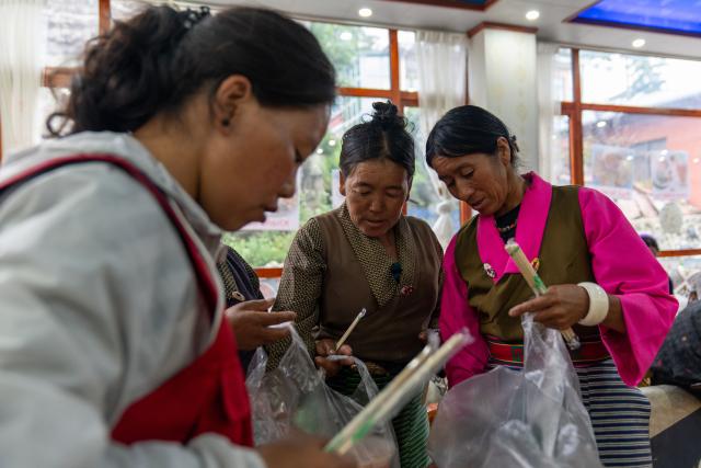 (260827) -- XIGAZE, Aug. 27, 2026 (Xinhua) -- Evacuees from Seqiong Village recieve meal provided by the government in Jifu Village of Gyirong County in Xigaze, southwest China's Xizang Autonomous Region, Aug. 27, 2026. Residents affected by a mudslide in Gyirong County, southwest China's Xizang Autonomous Region, have been resettled, and all stranded tourists have been transferred, local authorities said Thursday.
   A total of 499 villagers and construction workers have all been properly accommodated. Meanwhile, 555 affected tourists were evacuated and transferred under the coordination of cultural and tourism authorities. No tourists remain stranded.
   Civil aviation authorities have also joined the rescue efforts. As of 3 p.m. Thursday, civil aviation services had transported 324 rescue personnel and delivered 24 tonnes of rescue equipment, daily necessities and medical supplies to the disaster-hit area, providing support for emergency response and the relocation of affected residents.
   The mudslide struck Gyirong Port in Gyirong County, Xizang, on Wednesday morning. As of 8 a.m. on Thursday, three people had been killed, 558 others remained missing, while two local villagers had been rescued. (Xinhua/Tenzing Nima Qadhup)