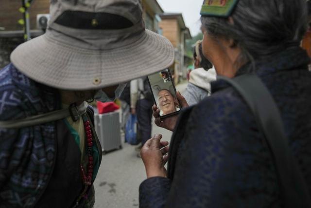 (260827) -- XIGAZE, Aug. 27, 2026 (Xinhua) -- Evacuees from Labi Village make a video call to their relative after resettled in Jifu Village of Gyirong County in Xigaze, southwest China's Xizang Autonomous Region, Aug. 27, 2026. Residents affected by a mudslide in Gyirong County, southwest China's Xizang Autonomous Region, have been resettled, and all stranded tourists have been transferred, local authorities said Thursday.
   A total of 499 villagers and construction workers have all been properly accommodated. Meanwhile, 555 affected tourists were evacuated and transferred under the coordination of cultural and tourism authorities. No tourists remain stranded.
   Civil aviation authorities have also joined the rescue efforts. As of 3 p.m. Thursday, civil aviation services had transported 324 rescue personnel and delivered 24 tonnes of rescue equipment, daily necessities and medical supplies to the disaster-hit area, providing support for emergency response and the relocation of affected residents.
   The mudslide struck Gyirong Port in Gyirong County, Xizang, on Wednesday morning. As of 8 a.m. on Thursday, three people had been killed, 558 others remained missing, while two local villagers had been rescued. (Xinhua/Jigme Dorje)