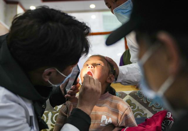 (260827) -- XIGAZE, Aug. 27, 2026 (Xinhua) -- A medical worker conducts medical check for a resettled girl in Jifu Village of Gyirong County in Xigaze, southwest China's Xizang Autonomous Region, Aug. 27, 2026. Residents affected by a mudslide in Gyirong County, southwest China's Xizang Autonomous Region, have been resettled, and all stranded tourists have been transferred, local authorities said Thursday.
   A total of 499 villagers and construction workers have all been properly accommodated. Meanwhile, 555 affected tourists were evacuated and transferred under the coordination of cultural and tourism authorities. No tourists remain stranded.
   Civil aviation authorities have also joined the rescue efforts. As of 3 p.m. Thursday, civil aviation services had transported 324 rescue personnel and delivered 24 tonnes of rescue equipment, daily necessities and medical supplies to the disaster-hit area, providing support for emergency response and the relocation of affected residents.
   The mudslide struck Gyirong Port in Gyirong County, Xizang, on Wednesday morning. As of 8 a.m. on Thursday, three people had been killed, 558 others remained missing, while two local villagers had been rescued. (Xinhua/Jigme Dorje)