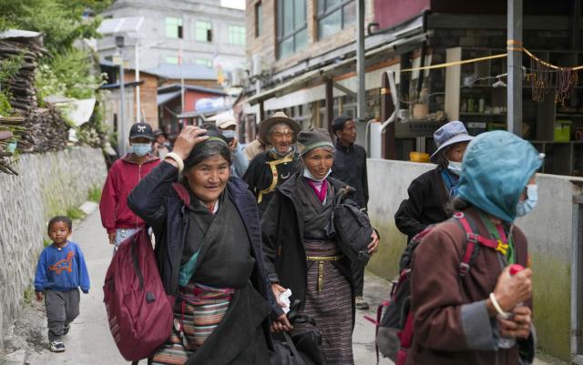 (260827) -- XIGAZE, Aug. 27, 2026 (Xinhua) -- Evacuees from Labi Village enter a hostel in Jifu Village of Gyirong County in Xigaze, southwest China's Xizang Autonomous Region, Aug. 27, 2026. Residents affected by a mudslide in Gyirong County, southwest China's Xizang Autonomous Region, have been resettled, and all stranded tourists have been transferred, local authorities said Thursday.
   A total of 499 villagers and construction workers have all been properly accommodated. Meanwhile, 555 affected tourists were evacuated and transferred under the coordination of cultural and tourism authorities. No tourists remain stranded.
   Civil aviation authorities have also joined the rescue efforts. As of 3 p.m. Thursday, civil aviation services had transported 324 rescue personnel and delivered 24 tonnes of rescue equipment, daily necessities and medical supplies to the disaster-hit area, providing support for emergency response and the relocation of affected residents.
   The mudslide struck Gyirong Port in Gyirong County, Xizang, on Wednesday morning. As of 8 a.m. on Thursday, three people had been killed, 558 others remained missing, while two local villagers had been rescued. (Xinhua/Jigme Dorje)