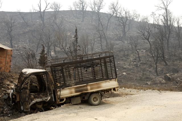 (260827) -- ALGIERS, Aug. 27, 2026 (Xinhua) -- Photo taken on Aug. 27, 2026 shows the aftermath of wildfires in a village in the mountains of Jijel, northeastern Algeria. At least 12 people were killed in wildfires that swept three provinces in northeastern Algeria, Interior Minister Said Sayoud said Wednesday evening. (Photo by Billel Bensalem/Xinhua)