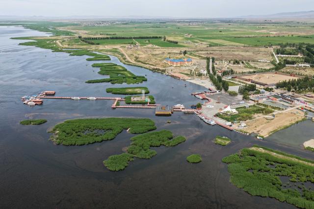 (260828) -- HULUN BUIR, Aug. 28, 2026 (Xinhua) -- An aerial drone photo taken on May 31, 2026 shows a view of Ulan Suhai Lake in Urad Front Banner of Bayannur, north China's Inner Mongolia Autonomous Region. Hulun Lake, Ulan Suhai Lake and Daihai Lake are three major freshwater lakes in Inner Mongolia. Once affected by natural and human factors, the lakes suffered from shrinking water areas and deteriorating water quality.
  Comprehensive ecological restoration efforts in recent years have brought notable improvements, with water quality steadily recovering and wildlife species increasing. 
  The three lakes are now playing a stronger role in safeguarding the ecological security of northern China. (Xinhua/Li Zhipeng)