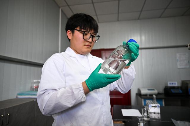 (260828) -- HULUN BUIR, Aug. 28, 2026 (Xinhua) -- A postgraduate student from Inner Mongolia Agricultural University checks a bottle of water sample at the State Gauge and Research Station of Wetland Ecosystem of Ulan Suhai Lake in Urad Front Banner of Bayannur, north China's Inner Mongolia Autonomous Region, May 31, 2026. Hulun Lake, Ulan Suhai Lake and Daihai Lake are three major freshwater lakes in Inner Mongolia. Once affected by natural and human factors, the lakes suffered from shrinking water areas and deteriorating water quality.
  Comprehensive ecological restoration efforts in recent years have brought notable improvements, with water quality steadily recovering and wildlife species increasing. 
  The three lakes are now playing a stronger role in safeguarding the ecological security of northern China. (Xinhua/Li Zhipeng)