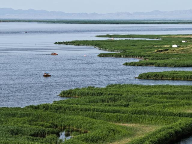 (260828) -- HULUN BUIR, Aug. 28, 2026 (Xinhua) -- An aerial drone photo taken on May 31, 2026 shows a view of Ulan Suhai Lake in Urad Front Banner of Bayannur, north China's Inner Mongolia Autonomous Region. Hulun Lake, Ulan Suhai Lake and Daihai Lake are three major freshwater lakes in Inner Mongolia. Once affected by natural and human factors, the lakes suffered from shrinking water areas and deteriorating water quality.
  Comprehensive ecological restoration efforts in recent years have brought notable improvements, with water quality steadily recovering and wildlife species increasing. 
  The three lakes are now playing a stronger role in safeguarding the ecological security of northern China. (Xinhua/Li Zhipeng)