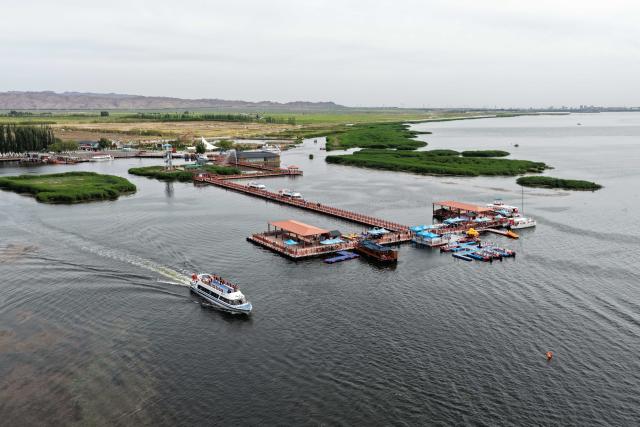 (260828) -- HULUN BUIR, Aug. 28, 2026 (Xinhua) -- An aerial drone photo taken on May 31, 2026 shows a view of Ulan Suhai Lake in Urad Front Banner of Bayannur, north China's Inner Mongolia Autonomous Region. Hulun Lake, Ulan Suhai Lake and Daihai Lake are three major freshwater lakes in Inner Mongolia. Once affected by natural and human factors, the lakes suffered from shrinking water areas and deteriorating water quality.
  Comprehensive ecological restoration efforts in recent years have brought notable improvements, with water quality steadily recovering and wildlife species increasing. 
  The three lakes are now playing a stronger role in safeguarding the ecological security of northern China. (Xinhua/Li Zhipeng)