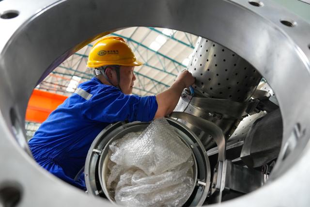 (260828) -- DEYANG, Aug. 28, 2026 (Xinhua) -- A worker assembles a 50-megawatt (MW) G50 turbine to be exported to Kazakhstan at a factory of Dongfang Turbine Co., Ltd. in Deyang City, southwest China's Sichuan Province, on June 22, 2026. China shipped its first domestically developed F-class heavy-duty gas turbine for overseas use on Friday, marking a step forward in its push to enter a global market long ruled by a handful of international manufacturers. 
   TO GO WITH "China exports first homegrown F-class heavy-duty gas turbine" (Xinhua/Xu Bingjie)
