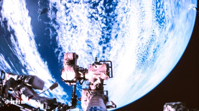 (260828) -- BEIJING, Aug. 28, 2026 (Xinhua) -- This screen image captured at Beijing Aerospace Control Center on Aug. 28, 2026 shows Shenzhou-23 astronaut Zhu Yangzhu performing extravehicular activities outside China's orbiting space station. The Shenzhou-23 crew aboard China's orbiting space station completed their mission's first series of extravehicular activities on Friday, according to the China Manned Space Agency (CMSA).
   The astronaut trio -- Zhu Yangzhu, Zhang Zhiyuan and Li Jiaying -- worked for approximately 5.5 hours and completed their tasks at 1:59 p.m. (Beijing Time), assisted by the space station's robotic arm and ground support teams. Zhu, who previously spacewalked three years ago, made his second excursion, while Zhang ventured outside for the first time.
   Zhu and Zhang installed debris shields and repaired the station's solar panels, ensuring the safety and stability of its power supply, according to the CMSA. This is the second time Chinese astronauts have performed such in-orbit maintenance tasks. (Photo by Yu Liqiang/Xinhua)