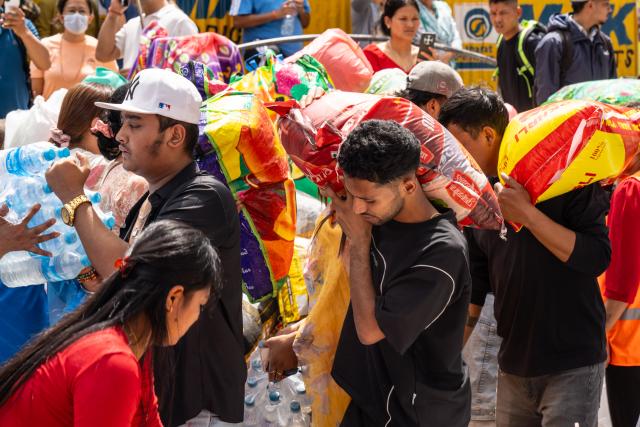 (260828) -- KATHMANDU, Aug. 28, 2026 (Xinhua) -- People transfer donated supplies for those affected by the flash flood, in Kathmandu, Nepal, on Aug. 28, 2026. Those supplies would be transported to the flash flood-hit areas in Nepal for people in need. 
   The death toll from devastating floods in Nepal has risen to 538, the National Disaster Risk Reduction and Management Authority said in a statement on Friday. (Photo by Hari Maharjan/Xinhua)