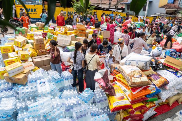 (260828) -- KATHMANDU, Aug. 28, 2026 (Xinhua) -- Volunteers work on donated supplies for those affected by the flash flood, in Kathmandu, Nepal, on Aug. 28, 2026. Those supplies would be transported to the flash flood-hit areas in Nepal for people in need. 
   The death toll from devastating floods in Nepal has risen to 538, the National Disaster Risk Reduction and Management Authority said in a statement on Friday. (Photo by Hari Maharjan/Xinhua)