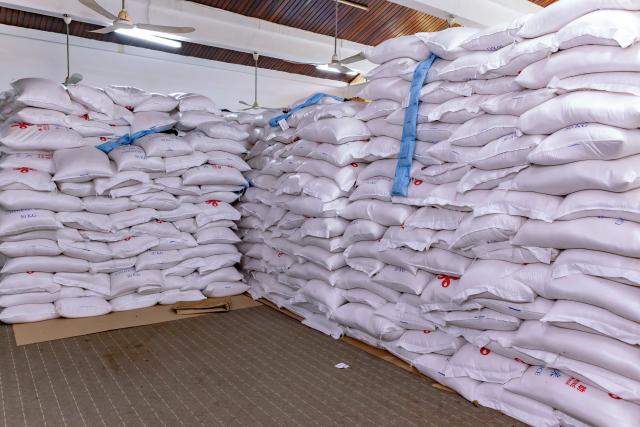 (260828) -- LIMBE, Aug. 28, 2026 (Xinhua) -- This photo taken on Aug. 18, 2026 shows bags of rice donated by China in Limbe, Southwest Region, Cameroon. TO GO WITH "Feature: Chinese-donated rice brings relief to vulnerable households in Cameroon" (Photo by Muleng Timngum/Xinhua)