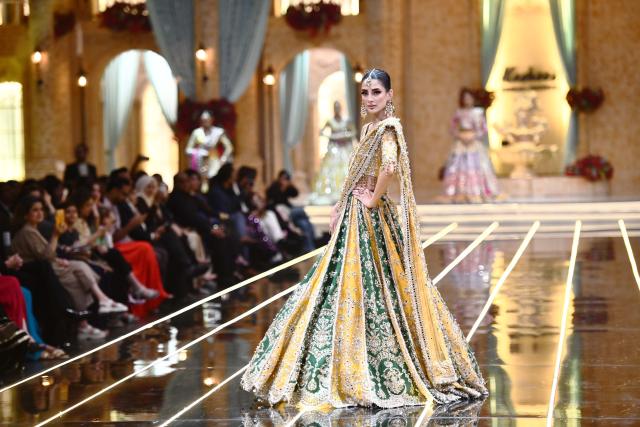 (260828) -- KARACHI, Aug. 28, 2026 (Xinhua) -- A model presents a bridal creation during a fashion show in southern Pakistani port city of Karachi on Aug. 28, 2026. (Str/Xinhua)