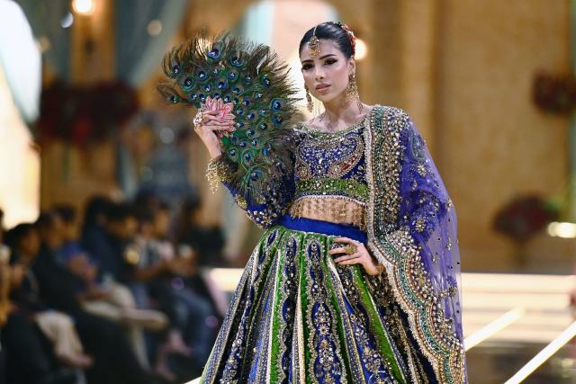 (260828) -- KARACHI, Aug. 28, 2026 (Xinhua) -- A model presents a bridal creation during a fashion show in southern Pakistani port city of Karachi on Aug. 28, 2026. (Str/Xinhua)