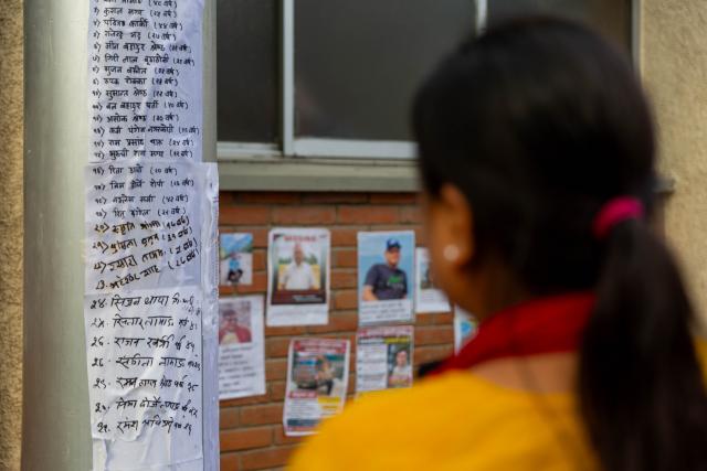 (260828) -- KATHMANDU, Aug. 28, 2026 (Xinhua) -- A woman looks at lists of people injured in a massive flood outside a hospital in Kathmandu, Nepal, on Aug. 28, 2026. The National Disaster Risk Reduction and Management Authority said 579 bodies have been recovered, while 1,924 people are out of contact as of Friday evening. (Photo by Sulav Shrestha/Xinhua)