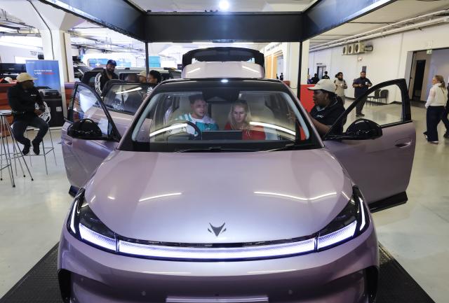 (260829) -- JOHANNESBURG, Aug. 29, 2026 (Xinhua) -- Visitors sit in a car at the booth of Chinese automaker BAIC during the Festival of Motoring in Johannesburg, South Africa, Aug. 28, 2026.
  The 9th edition of the Festival of Motoring kicked off on Friday at Kyalami Grand Prix Circuit in Johannesburg. Chinese automakers showcase their latest models at the event. (Xinhua/Chen Wei)