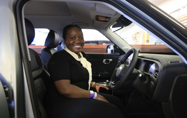 (260829) -- JOHANNESBURG, Aug. 29, 2026 (Xinhua) -- A visitor sits in a car of Chinese automaker BAIC during the Festival of Motoring in Johannesburg, South Africa, Aug. 28, 2026.
  The 9th edition of the Festival of Motoring kicked off on Friday at Kyalami Grand Prix Circuit in Johannesburg. Chinese automakers showcase their latest models at the event. (Xinhua/Chen Wei)