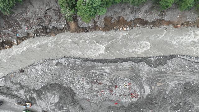 (260829) -- GYIRONG, Aug. 29, 2026 (Xinhua) -- This aerial drone photo shows rescuers repairing a section of national highway G216 leading to the Gyirong Port in Gyirong County, southwest China's Xizang Autonomous Region, on Aug. 29, 2026. (Xinhua/Jigme Dorje)