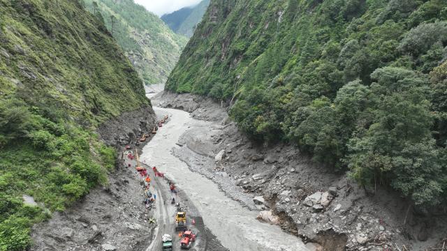 (260829) -- GYIRONG, Aug. 29, 2026 (Xinhua) -- This aerial drone photo shows rescuers repairing a section of national highway G216 leading to the Gyirong Port in Gyirong County, southwest China's Xizang Autonomous Region, on Aug. 29, 2026. (Xinhua/Jigme Dorje)