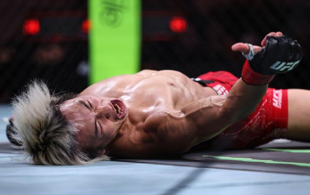 (260829) -- SHANGHAI, Aug. 29, 2026 (Xinhua) -- Tsuruya Rei of Japan reacts after defeating Kevin Borjas of Peru during the UFC Fight Night Flyweight Bout 3 Rounds at the Oriental Sports Center in east China's Shanghai, Aug. 29, 2026. (Xinhua/Li Ming)