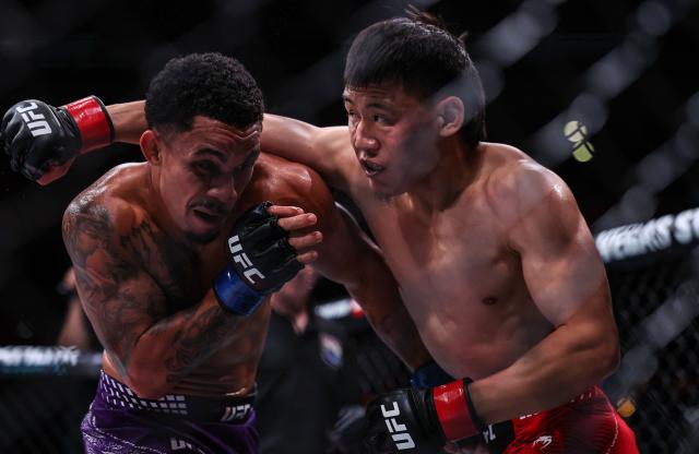 (260829) -- SHANGHAI, Aug. 29, 2026 (Xinhua) -- Andre Lima (L) of Brazil competes against Namsrai Batbayar of Mongolia during the UFC Fight Night Flyweight Bout 3 Rounds at the Oriental Sports Center in east China's Shanghai, Aug. 29, 2026. (Xinhua/Li Ming)