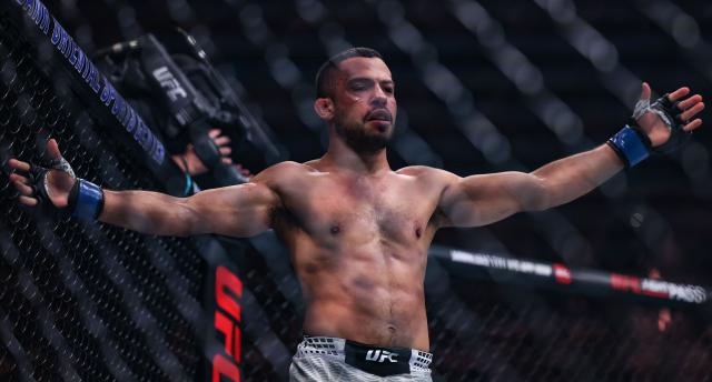 (260829) -- SHANGHAI, Aug. 29, 2026 (Xinhua) -- Hector Santiago of Brazil celebrates after defeating Lawrence Lui of New Zealand during the UFC Fight Night Bantamweight Bout 3 Rounds at the Oriental Sports Center in east China's Shanghai, Aug. 29, 2026. (Xinhua/Li Ming)