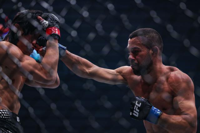 (260829) -- SHANGHAI, Aug. 29, 2026 (Xinhua) -- Hector Santiago (R) of Brazil competes against Lawrence Lui of New Zealand during the UFC Fight Night Bantamweight Bout 3 Rounds at the Oriental Sports Center in east China's Shanghai, Aug. 29, 2026. (Xinhua/Li Ming)