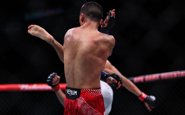 (260829) -- SHANGHAI, Aug. 29, 2026 (Xinhua) -- Bilal Hasan of Indonesia competes against Nilson Rojas (front) of Chile during the UFC Fight Night Flyweight Bout 3 Rounds at the Oriental Sports Center in east China's Shanghai, Aug. 29, 2026. (Xinhua/Li Ming)