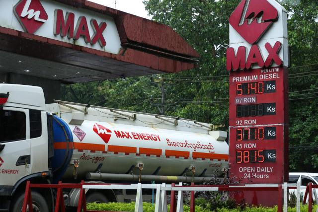 (260829) -- YANGON, Aug. 29, 2026 (Xinhua) -- A billboard indicating fuel prices is seen in front of a petrol station in Yangon, Myanmar, Aug. 29, 2026. Myanmar fuel price caps have risen to 3,710 kyats (about 1.76 U.S. dollars) per liter for 92 RON gasoline and 3,815 kyats for 95 RON, while diesel has increased to 4,240 kyats and premium diesel to 5,140 kyats, the Petroleum Products Regulatory Department said on Friday. (Xinhua/Myo Kyaw Soe)