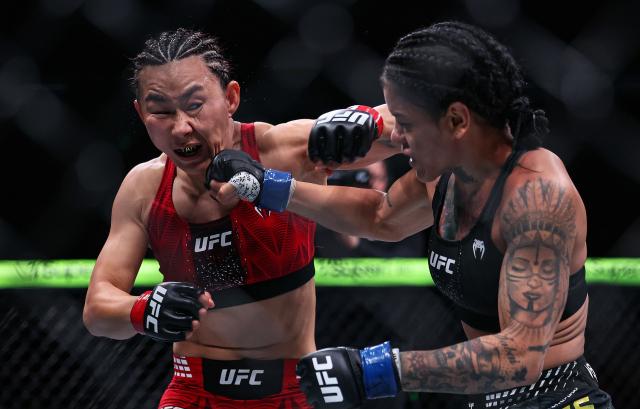 (260829) -- SHANGHAI, Aug. 29, 2026 (Xinhua) -- Yan Xiaonan (L) of China competes against Denise Gomes of Brazil during the UFC Fight Night Women's Strawweight Bout 3 Rounds at the Oriental Sports Center in east China's Shanghai, Aug. 29, 2026. (Xinhua/Li Ming)