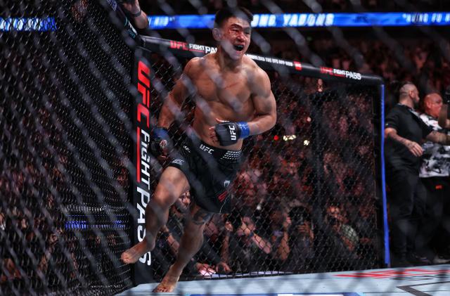 (260829) -- SHANGHAI, Aug. 29, 2026 (Xinhua) -- Song Yadong of China celebrates after winng the UFC Fight Night Bantamweight Bout (Main Event) 5 Rounds against Umar Nurmagomedov of Russia at the Oriental Sports Center in east China's Shanghai, Aug. 29, 2026. (Xinhua/Li Ming)