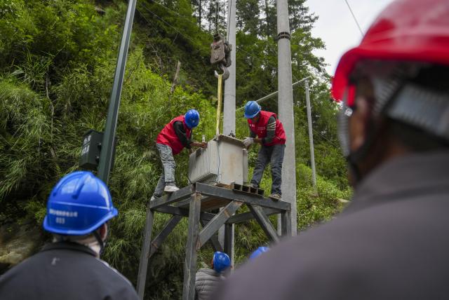 (260829) -- GYIRONG, Aug. 29, 2026 (Xinhua) -- Staff members install a power transformer about 3 kilometers from mudslide-hit Gyirong Port in Gyirong County, southwest China's Xizang Autonomous Region, Aug. 29, 2026. Staff members of the local power company has set up an emergency power transformer not far from the mudslide-hit Gyirong Port, as part of their efforts to ensure power supply for all rescue operations. Power supply is gradually restored in the mudslide-hit areas. (Xinhua/Jigme Dorje)