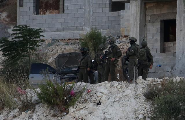 (260829) -- JENIN, Aug. 29, 2026 (Xinhua) -- Israeli military forces are seen at the area where three Palestinians were killed by an Israeli military airstrike, in the West Bank city of Jenin, Aug. 28, 2026. At least three Palestinians were killed Friday in an Israeli airstrike targeting the city of Jenin in the northern West Bank, Palestinian sources said.
Local Palestinian sources told Xinhua an Israeli warplane struck a house in the Harsh al-Saada area of the city, killing three Palestinians. (Photo by Nidal Eshtayeh/Xinhua)