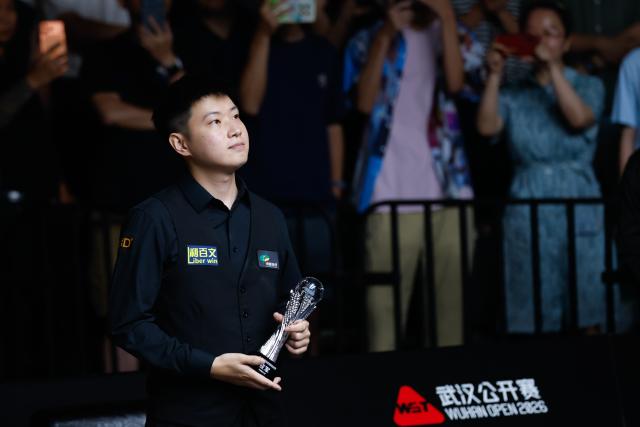(260830) -- WUHAN, Aug. 30, 2026 (Xinhua) -- Zhao Xintong reacts after the final match between Zhao Xintong of China and Chang Bingyu of China at Wuhan Open 2026 snooker tournament in Wuhan, central China's Hubei Province, Aug. 29, 2026. (Xinhua/Wu Zhizun)